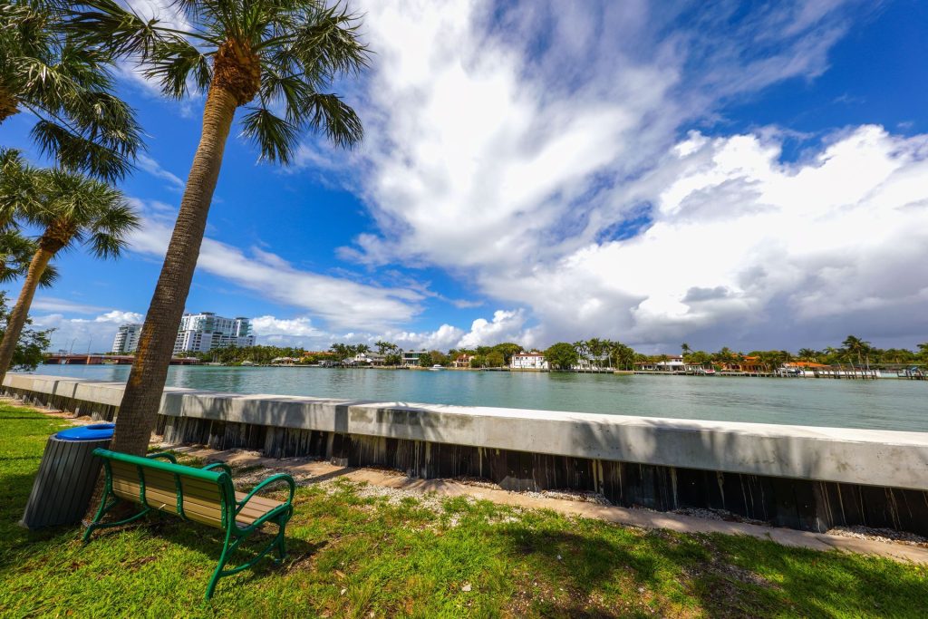 New concrete seawall cap along a waterfront park walkway. Retaining wall and seawall construction, Anderson Dock and Lift, Sarasota FL.