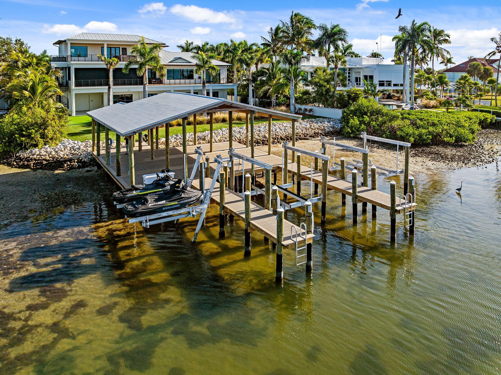 Covered boat dock with lift on a Bradenton canal