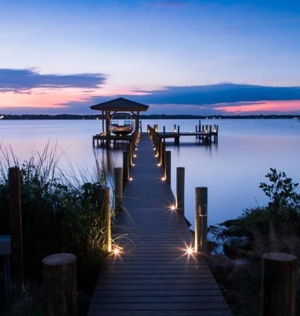 Lit boat dock at dusk on Florida’s Gulf Coast